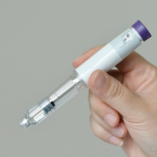 glp-1 medication held in someone's hand on a gray background