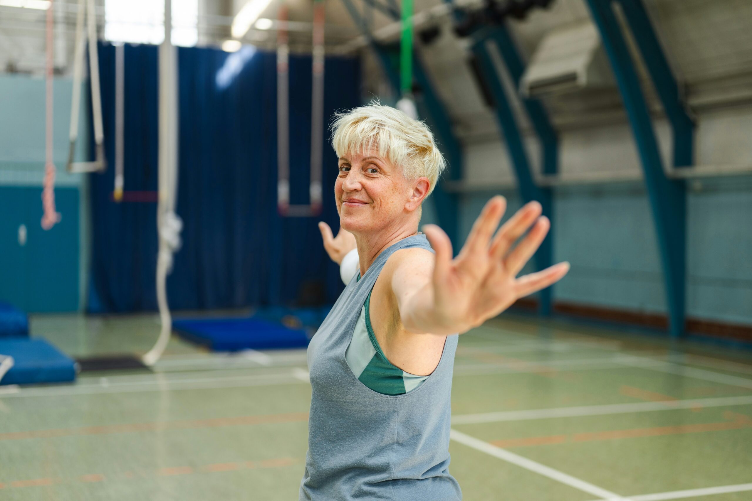An elderly woman exercises after increasing energy with magnesium malate